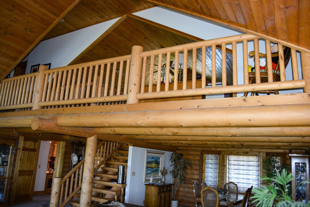 Spacious living area in beautiful log home with open, vaulted ceilings.