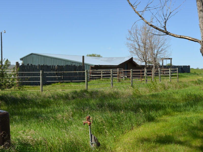 Horse property for sale near Billings Montana includes this horse barn and corrals.